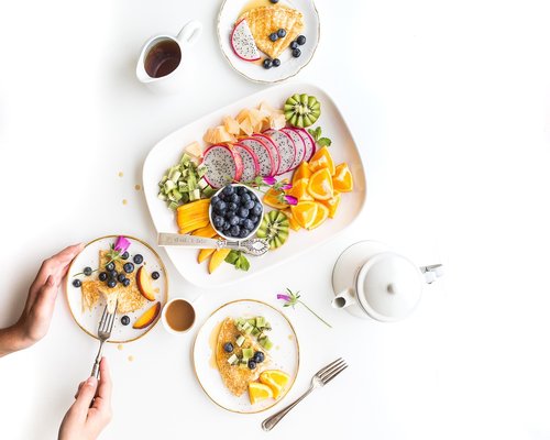 Balanced breakfast with eggs flatbread tea and fresh fruit