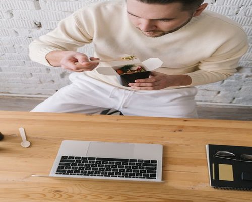 Adult man packing a practical lunch before going to work